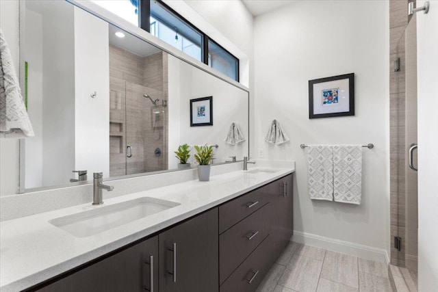 1706 Canterbury St, Austin, TX 78702 - bathroom featuring double vanity, a shower stall, and baseboards