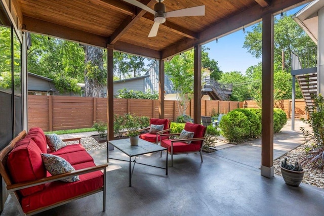 1706 Canterbury St, Austin, TX 78702 - fenced backyard featuring a patio, an outdoor hangout area, and ceiling fan