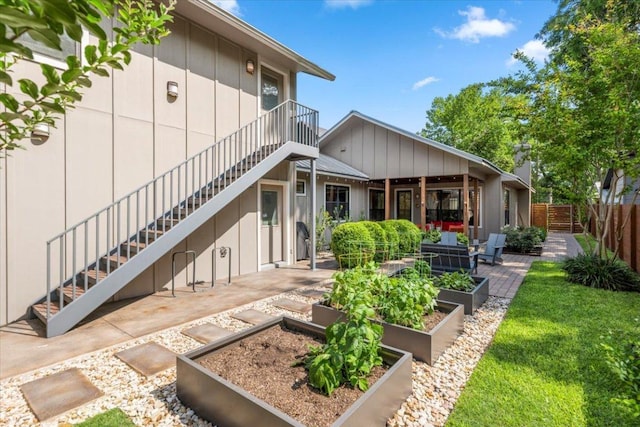 1706 Canterbury St, Austin, TX 78702 - rear view of house featuring a garden, stairs, and a patio area