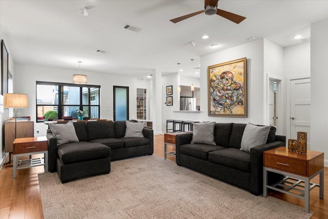 1706 Canterbury St, Austin, TX 78702 - living area with ceiling fan, wood finished floors, and recessed lighting