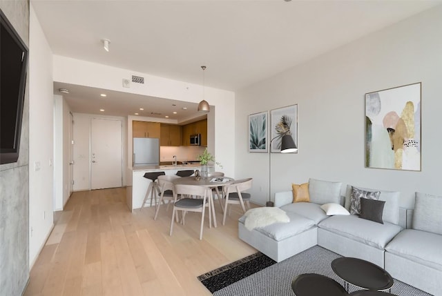 301 W Ave Unit 2003, Austin, TX 78701 - living area with light wood-type flooring and recessed lighting