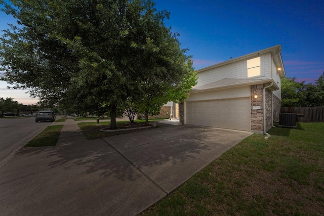 633 Sweet Leaf Ln, Pflugerville, TX 78660 - view of front facade featuring concrete driveway, central AC, and brick siding