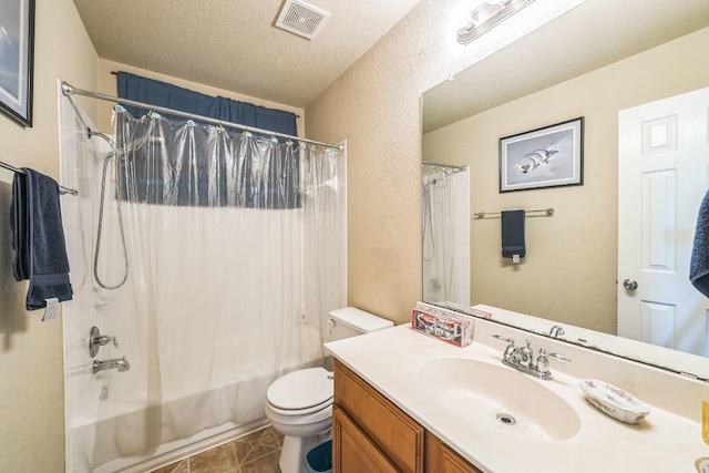 633 Sweet Leaf Ln, Pflugerville, TX 78660 - full bath with vanity, toilet, shower / bath combo with shower curtain, a textured wall, and tile patterned flooring