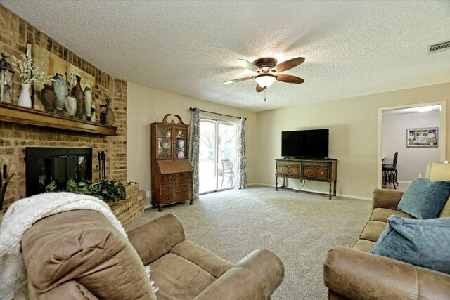 304 White Wing Way, Round Rock, TX 78664 - living area with carpet, ceiling fan, a fireplace, a textured ceiling, and baseboards