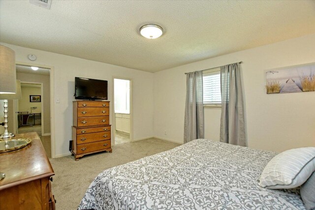 304 White Wing Way, Round Rock, TX 78664 - carpeted bedroom with a textured ceiling and baseboards