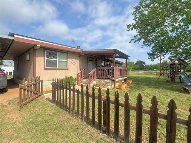 1415 Bee Ln, Tow, TX 78672 - manufactured / mobile home with a playground and a carport
