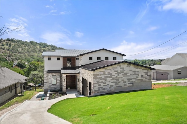 335 Sandy Mountain Dr, Sunrise Beach, TX 78643 - view of front facade with stone siding, a front yard, and metal roof