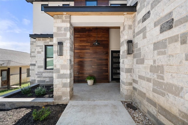 335 Sandy Mountain Dr, Sunrise Beach, TX 78643 - view of exterior entry with stone siding