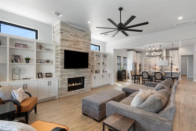 335 Sandy Mountain Dr, Sunrise Beach, TX 78643 - living room featuring light wood-style flooring, ceiling fan, healthy amount of natural light, and recessed lighting