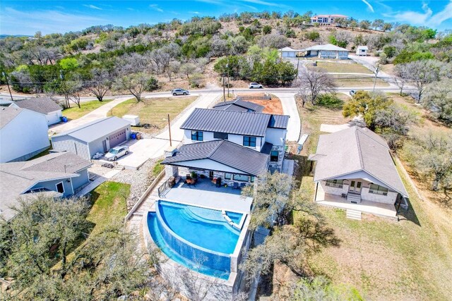 335 Sandy Mountain Dr, Sunrise Beach, TX 78643 - aerial view of property and surrounding area featuring a pool
