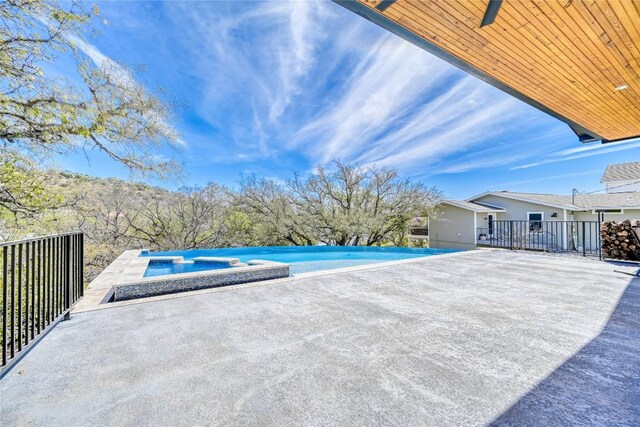 335 Sandy Mountain Dr, Sunrise Beach, TX 78643 - view of patio / terrace with a pool with connected hot tub