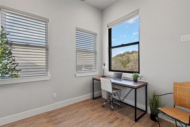 335 Sandy Mountain Dr, Sunrise Beach, TX 78643 - home office with baseboards and wood finished floors