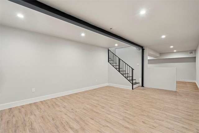 335 Sandy Mountain Dr, Sunrise Beach, TX 78643 - finished below grade area with recessed lighting, light wood-style flooring, stairs, and baseboards