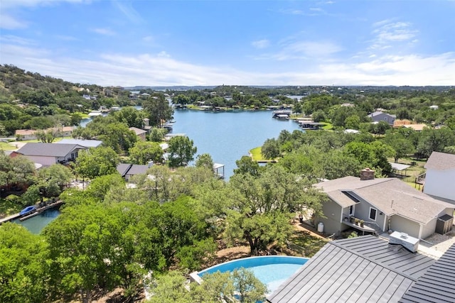 335 Sandy Mountain Dr, Sunrise Beach, TX 78643 - aerial view of residential area featuring a large body of water and a tree filled landscape