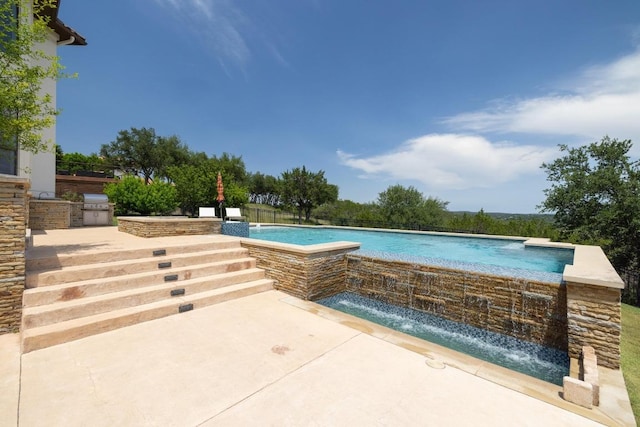 1501 University Club Dr, Austin, TX 78732 - view of swimming pool featuring an infinity pool, a patio area, and a grill