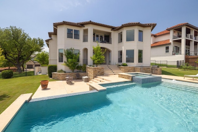 1501 University Club Dr, Austin, TX 78732 - back of house with a patio, stucco siding, a pool with connected hot tub, and a tiled roof