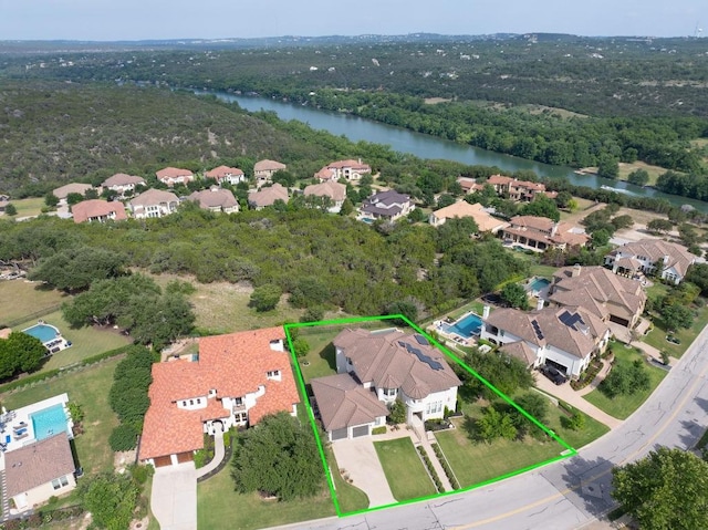 1501 University Club Dr, Austin, TX 78732 - aerial perspective of suburban area with a large body of water, property boundaries highlighted, and a forest