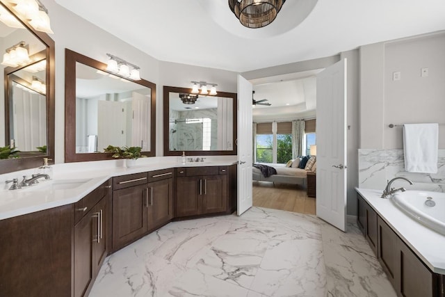 1501 University Club Dr, Austin, TX 78732 - full bathroom with ensuite bath, a marble finish shower, double vanity, a garden tub, and marble finish flooring