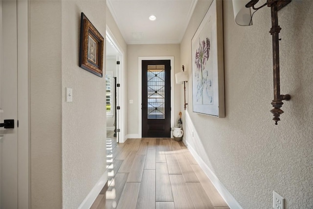 5820 Harper Park Dr Unit 66, Austin, TX 78735 - entryway featuring light wood finished floors, baseboards, crown molding, and a textured wall