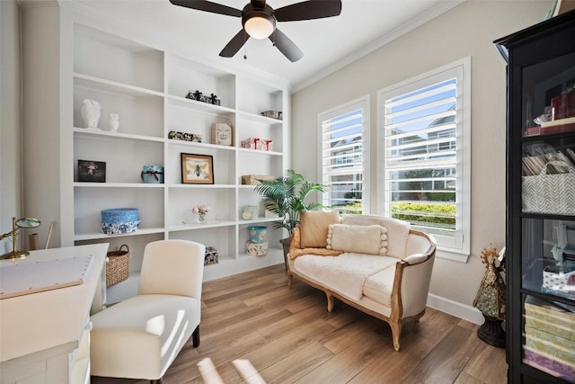 5820 Harper Park Dr Unit 66, Austin, TX 78735 - sitting room with a ceiling fan, ornamental molding, healthy amount of natural light, light wood-style floors, and baseboards