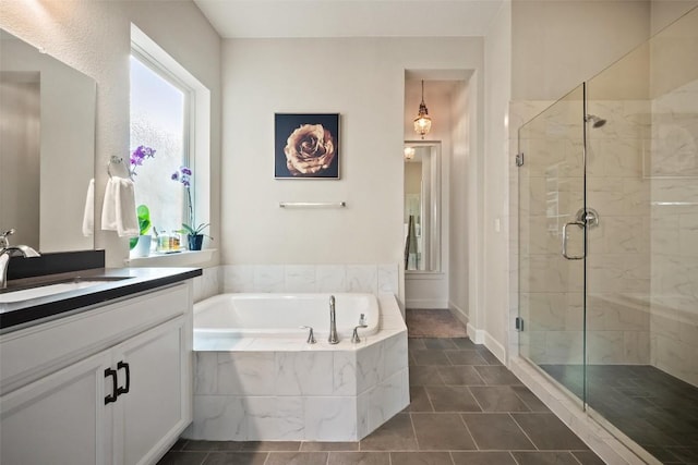 5820 Harper Park Dr Unit 66, Austin, TX 78735 - bathroom featuring a bath, vanity, a stall shower, and tile patterned flooring
