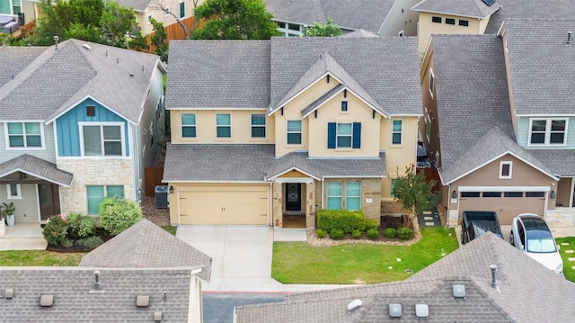 5820 Harper Park Dr Unit 66, Austin, TX 78735 - view of front of house featuring a residential view, concrete driveway, stucco siding, stone siding, and cooling unit