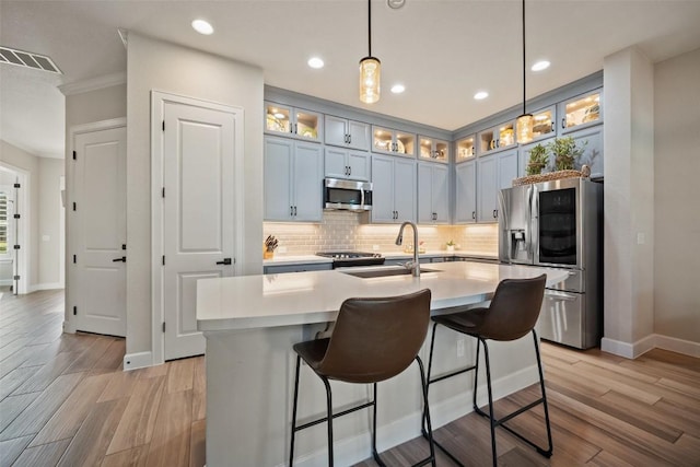 5820 Harper Park Dr Unit 66, Austin, TX 78735 - kitchen featuring stainless steel appliances, a sink, baseboards, decorative backsplash, and recessed lighting