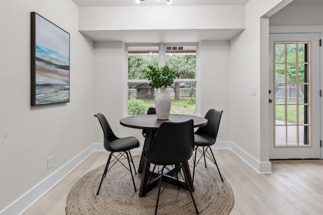 13322 Villa Park Dr, Austin, TX 78729 - dining room with light wood-style floors and baseboards