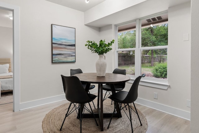 13322 Villa Park Dr, Austin, TX 78729 - dining room with light wood-type flooring and baseboards