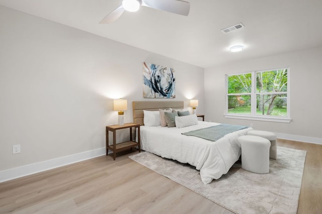 13322 Villa Park Dr, Austin, TX 78729 - bedroom with wood finished floors, baseboards, and a ceiling fan