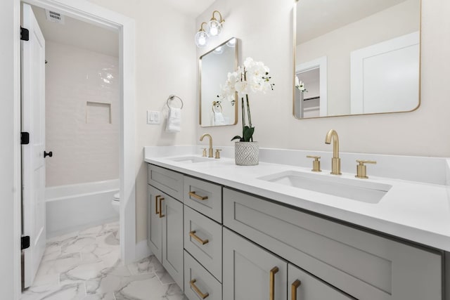 13322 Villa Park Dr, Austin, TX 78729 - full bathroom with double vanity, marble finish flooring, toilet,  shower combination, and baseboards