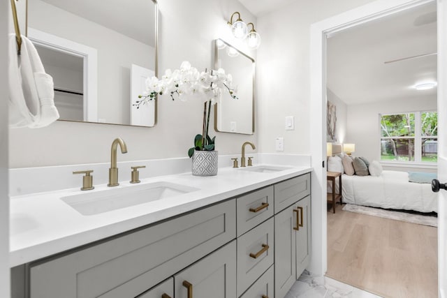 13322 Villa Park Dr, Austin, TX 78729 - bathroom with double vanity, ensuite bath, and marble finish flooring