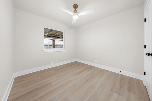 13322 Villa Park Dr, Austin, TX 78729 - spare room with light wood-type flooring, ceiling fan, and baseboards