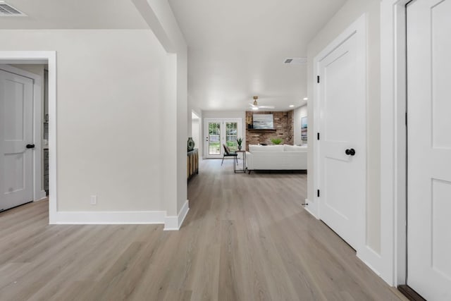 13322 Villa Park Dr, Austin, TX 78729 - hallway with light wood-style floors, baseboards, and recessed lighting