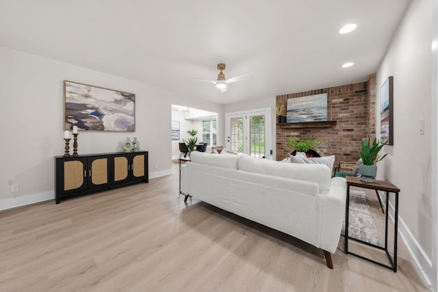 13322 Villa Park Dr, Austin, TX 78729 - living area featuring light wood-style flooring, baseboards, a ceiling fan, and french doors