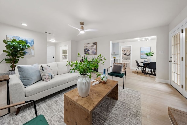 13322 Villa Park Dr, Austin, TX 78729 - living room with light wood-style flooring, healthy amount of natural light, baseboards, a chandelier, and recessed lighting