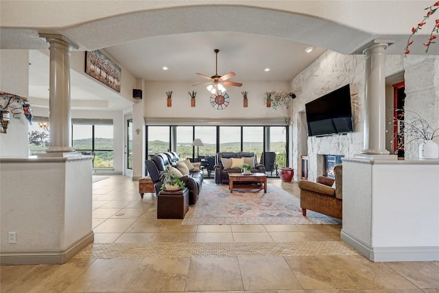 17400 Northlake Hills Dr, Jonestown, TX 78645 - living room with decorative columns, a ceiling fan, baseboards, and recessed lighting