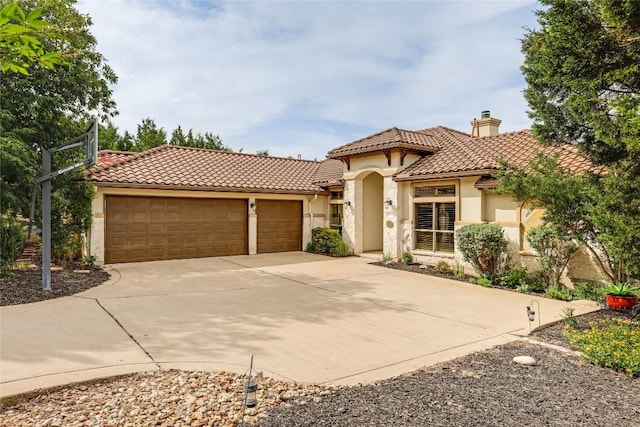 17400 Northlake Hills Dr, Jonestown, TX 78645 - mediterranean / spanish-style home with stucco siding, driveway, a tiled roof, a chimney, and a garage