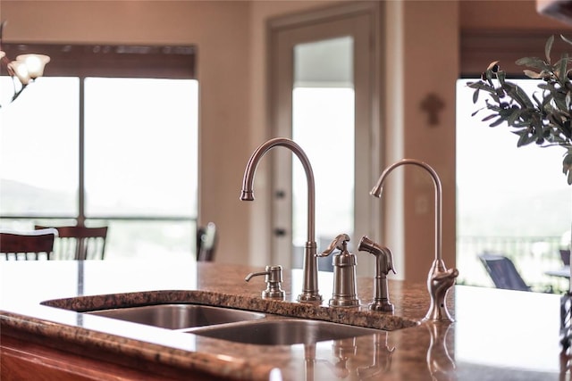 17400 Northlake Hills Dr, Jonestown, TX 78645 - kitchen view of dark stone counters and a sink