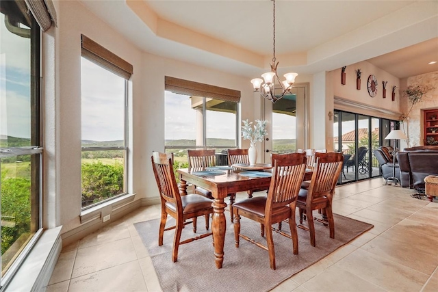17400 Northlake Hills Dr, Jonestown, TX 78645 - dining space with healthy amount of natural light, a chandelier, and light tile patterned floors