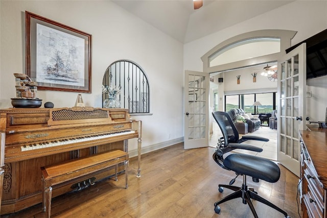 17400 Northlake Hills Dr, Jonestown, TX 78645 - home office featuring french doors, a ceiling fan, wood finished floors, vaulted ceiling, and baseboards