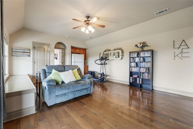 17400 Northlake Hills Dr, Jonestown, TX 78645 - living area with lofted ceiling, ceiling fan, arched walkways, dark wood-style flooring, and baseboards
