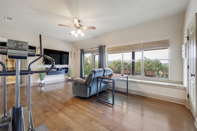 17400 Northlake Hills Dr, Jonestown, TX 78645 - exercise area with ceiling fan, baseboards, and hardwood / wood-style flooring