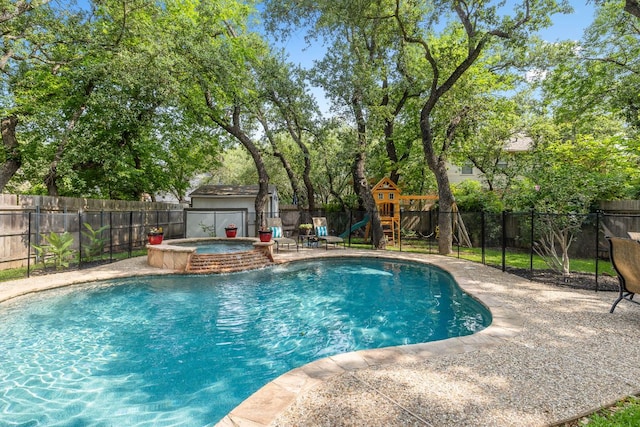 3808 Royal Troon Dr, Round Rock, TX 78664 - view of pool with a fenced backyard, a playground, a pool with connected hot tub, and a patio area