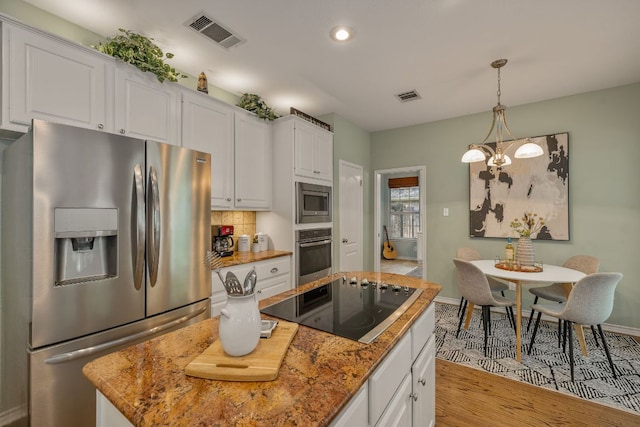 3808 Royal Troon Dr, Round Rock, TX 78664 - kitchen featuring appliances with stainless steel finishes, light wood finished floors, white cabinetry, baseboards, and recessed lighting
