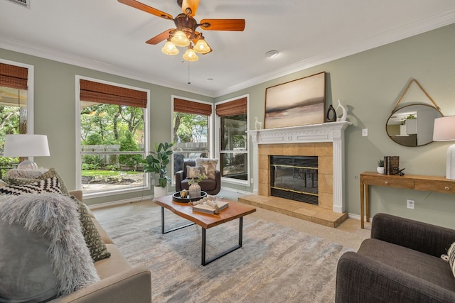 3808 Royal Troon Dr, Round Rock, TX 78664 - living area with healthy amount of natural light, ceiling fan, ornamental molding, a tile fireplace, and baseboards
