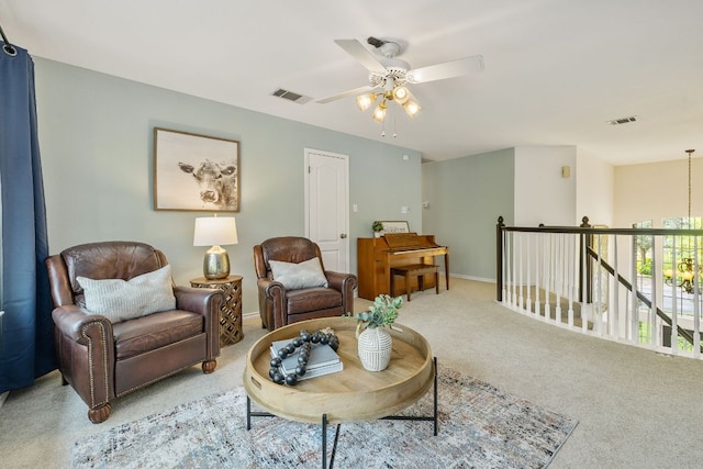 3808 Royal Troon Dr, Round Rock, TX 78664 - sitting room featuring light colored carpet, a ceiling fan, baseboards, and an upstairs landing