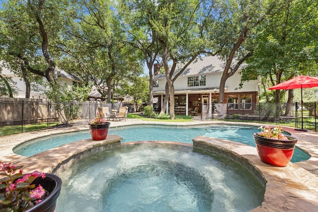 3808 Royal Troon Dr, Round Rock, TX 78664 - view of pool with a pool with connected hot tub and a fenced backyard