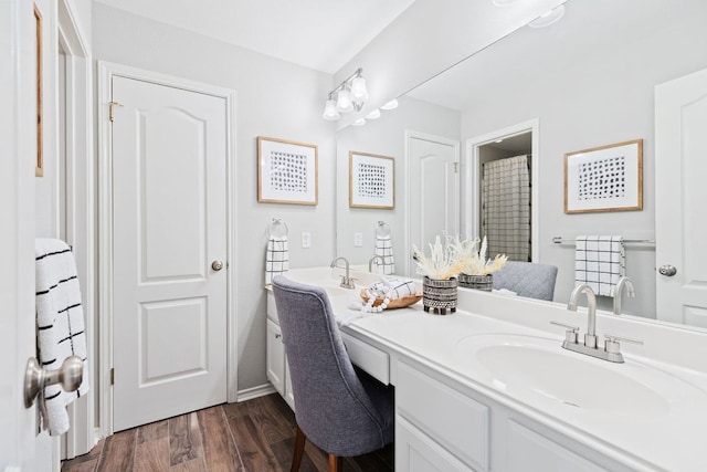 3808 Royal Troon Dr, Round Rock, TX 78664 - bathroom featuring double vanity and wood finished floors
