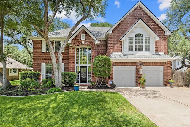 3808 Royal Troon Dr, Round Rock, TX 78664 - view of front of home featuring brick siding, a garage, driveway, and roof with shingles